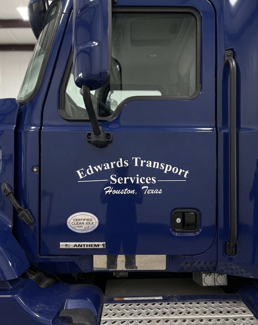 Edwards Transport Services lettering on a blue Mack cab door in Houston, Texas