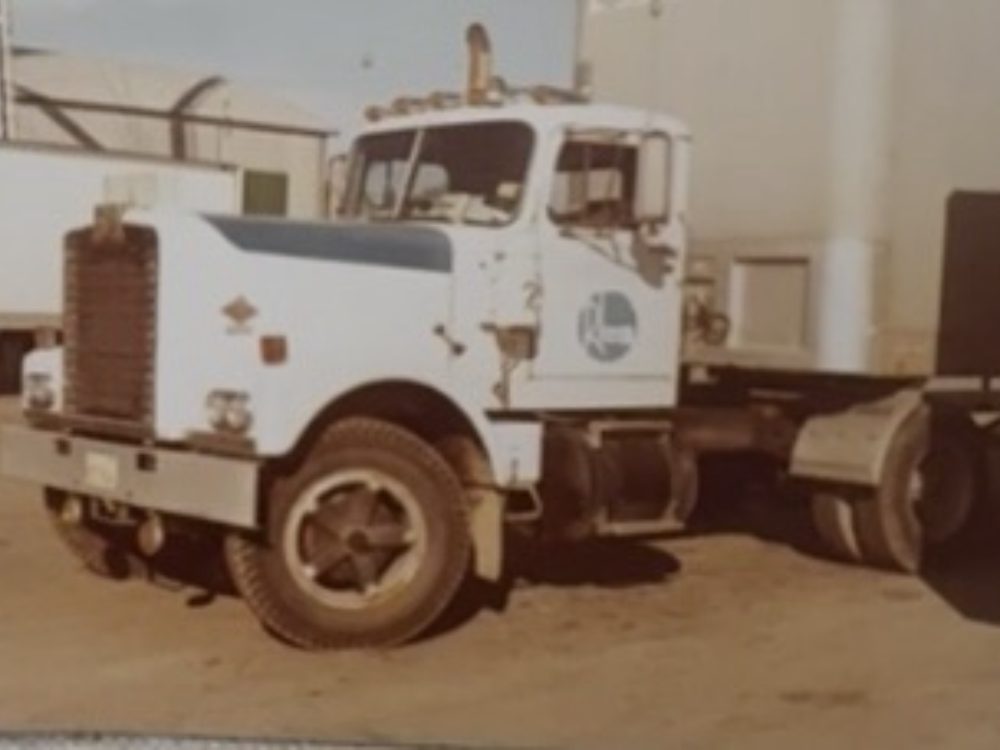 Early Edwards Transport white day-cab tractor with company logo, 1970s-80s