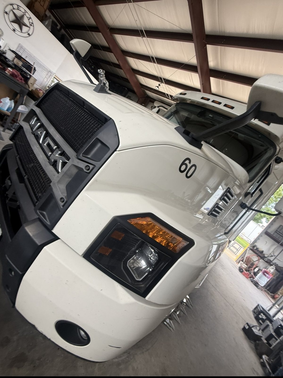 White Mack Anthem tractor Unit 60 in the Edwards Transport Services shop, Houston, Texas